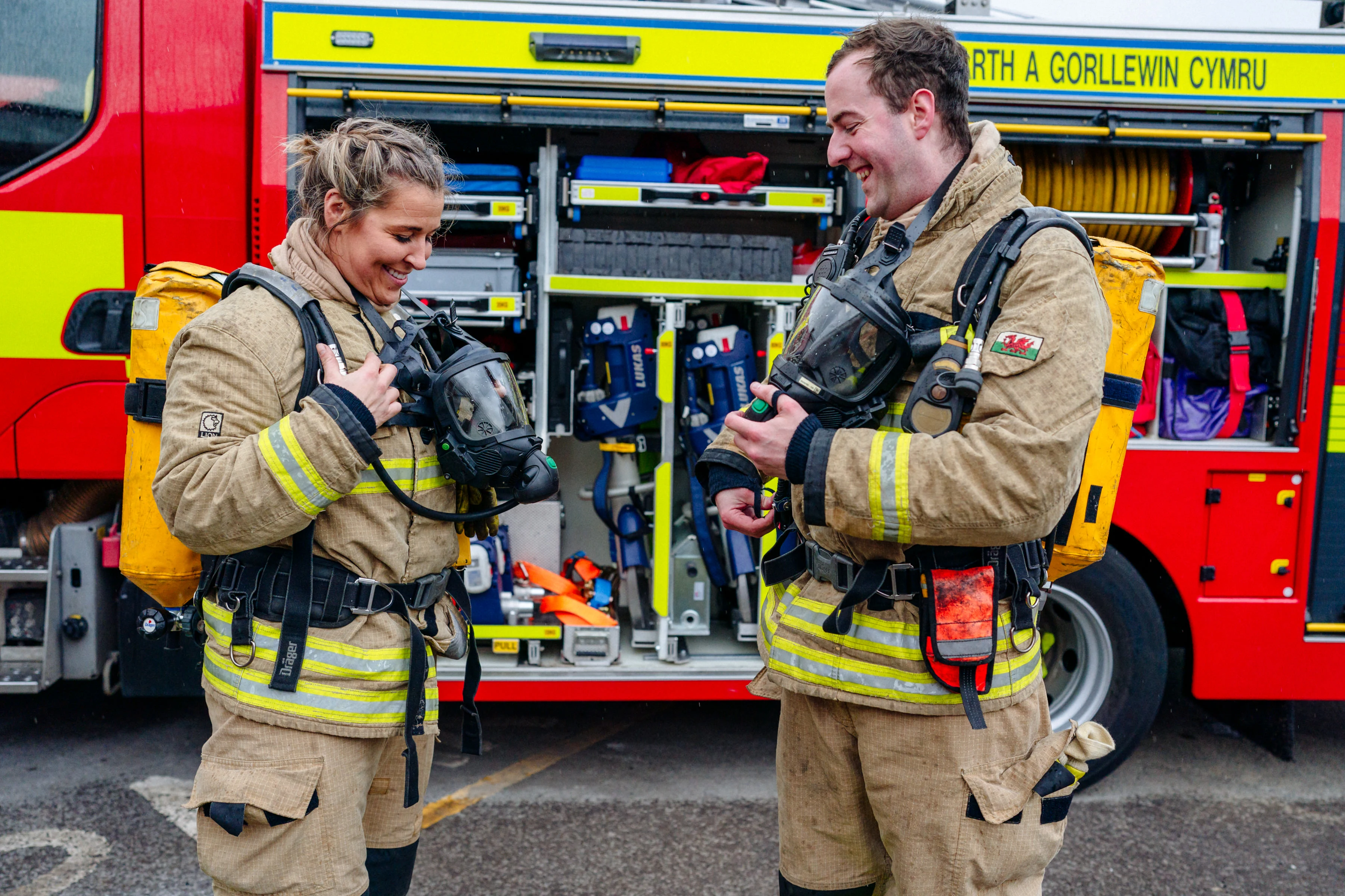 fire fighters beside fire engine